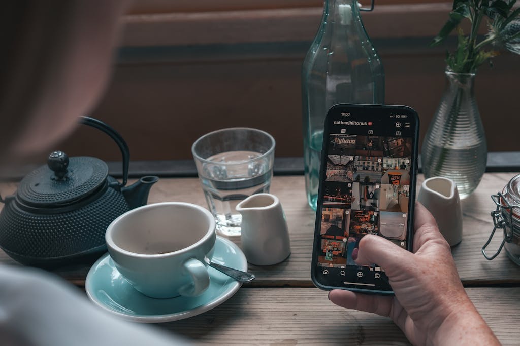 Hand Holding Smartphone with Instagram